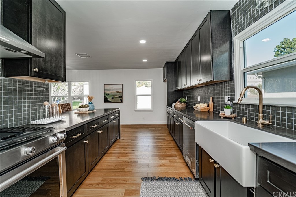 3880 Fairway Boulevard View Park, CA 90043 - Photo 16 of 47 a large kitchen with stainless steel appliances