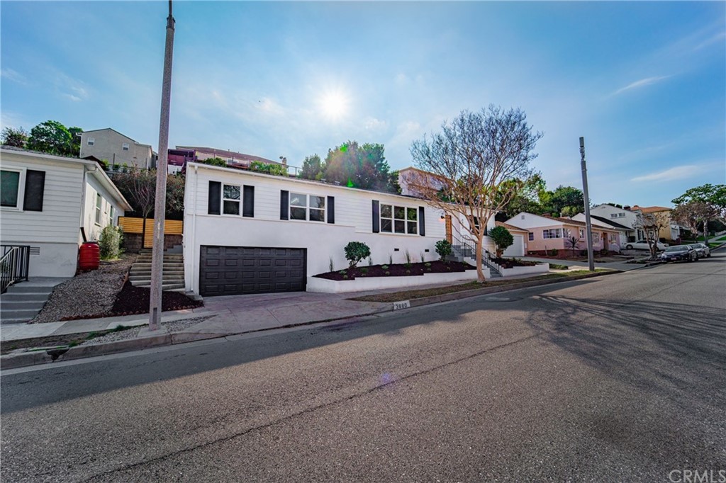 3880 Fairway Boulevard View Park, CA 90043 - Photo 2 of 47 a group of cars parked in front of a house