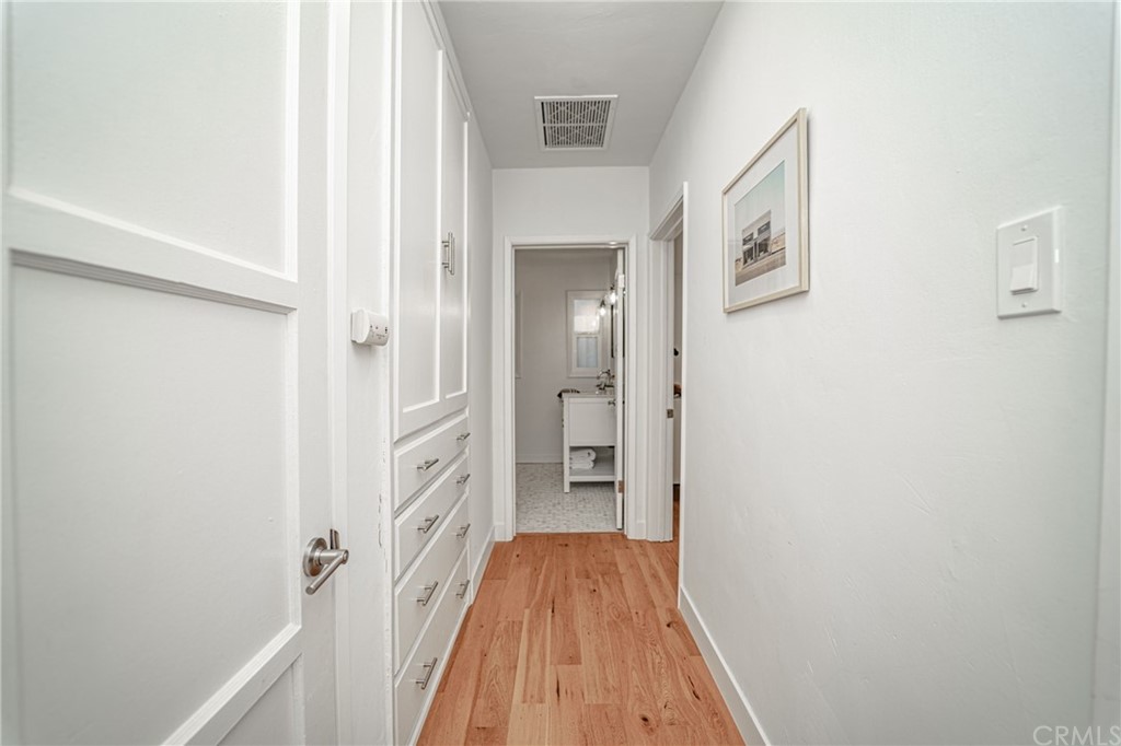 3880 Fairway Boulevard View Park, CA 90043 - Photo 22 of 47 a view of a hallway with wooden floor and closet