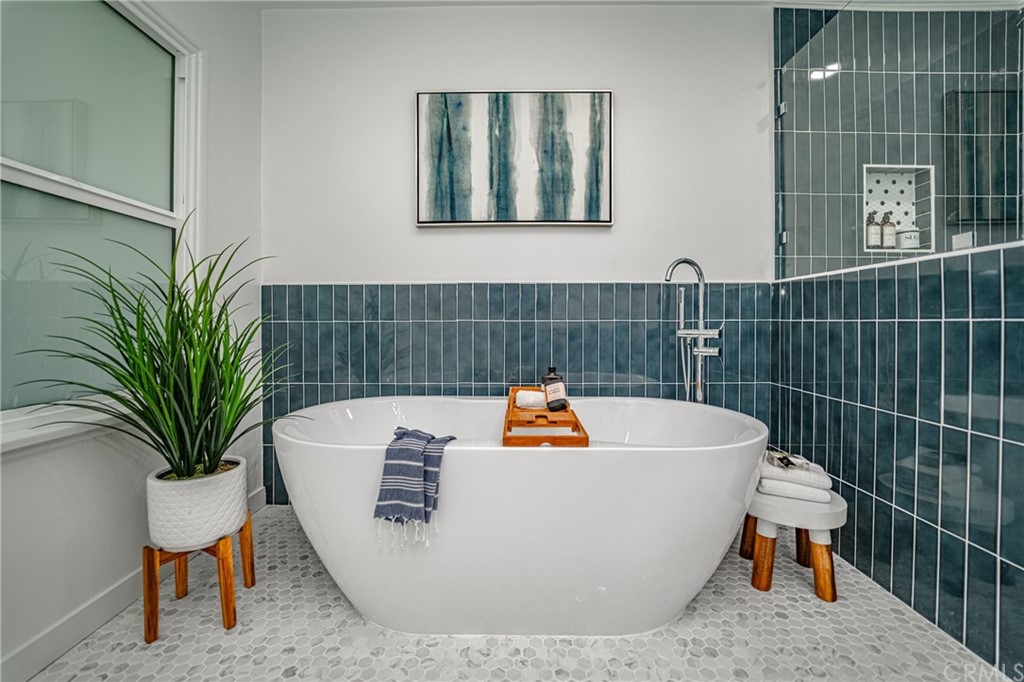 3880 Fairway Boulevard View Park, CA 90043 - Photo 31 of 47 a white bath tub sitting next to a white toilet