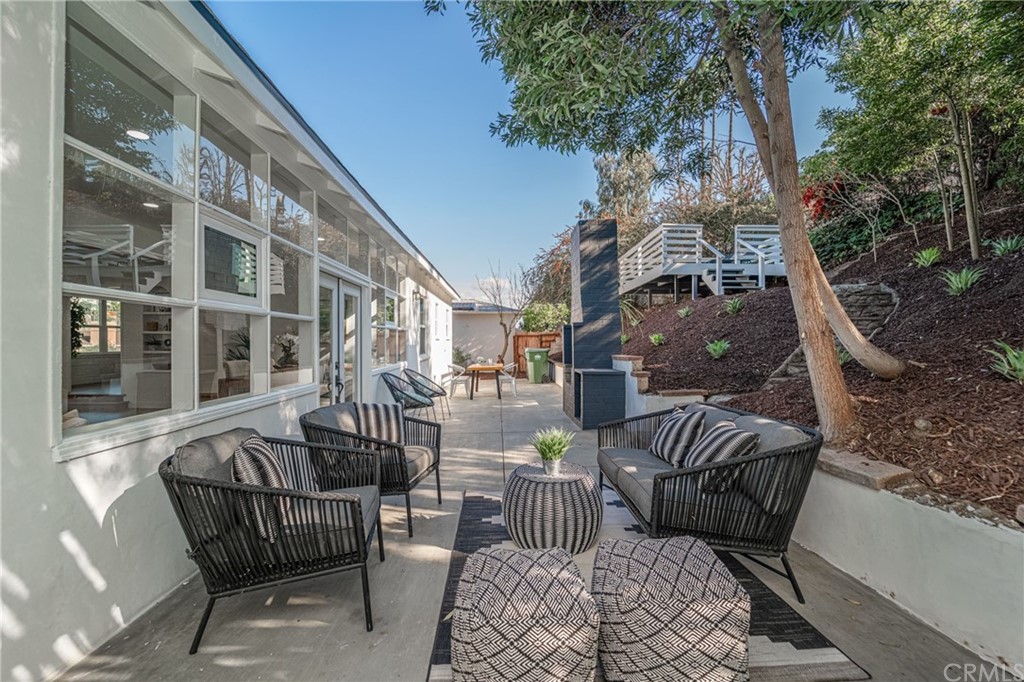 3880 Fairway Boulevard View Park, CA 90043 - Photo 37 of 47 a view of a patio with couches table and chairs and potted plants