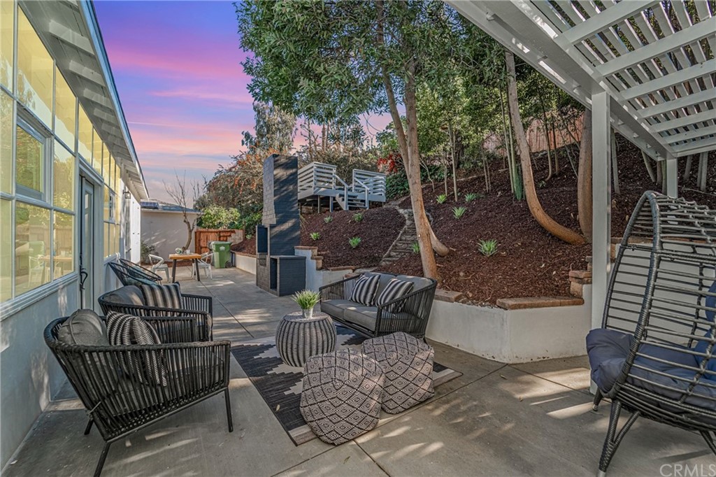 3880 Fairway Boulevard View Park, CA 90043 - Photo 38 of 47 a view of a patio with couches table and chairs and potted plants