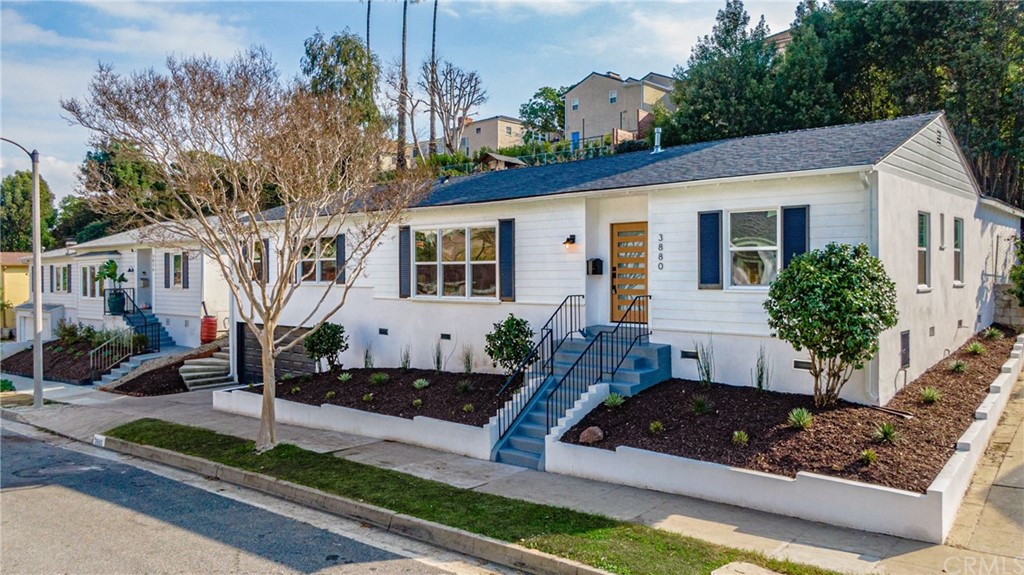 3880 Fairway Boulevard View Park, CA 90043 - Photo 4 of 47 a front view of a house with garden