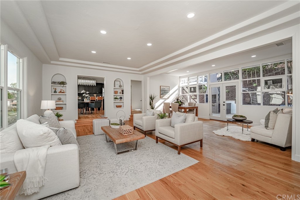3880 Fairway Boulevard View Park, CA 90043 - Photo 6 of 47 a living room with furniture and a wooden floor