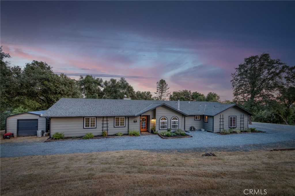 40955 Jean Road West Oakhurst, CA 93644 - Photo 1 of 1 a front view of a house with a yard