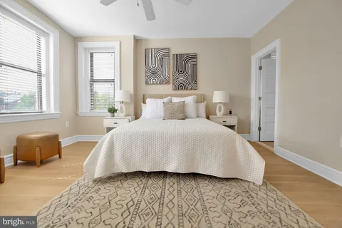 a bedroom with a bed and a couch