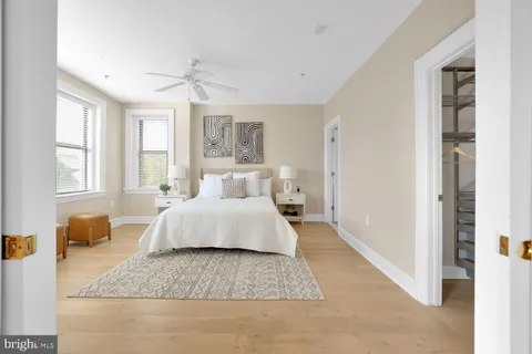 a spacious bedroom with a large bed and a couch