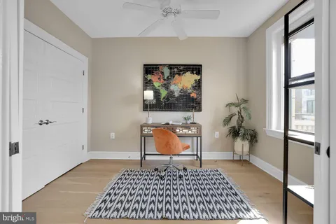 a bedroom with furniture and a window