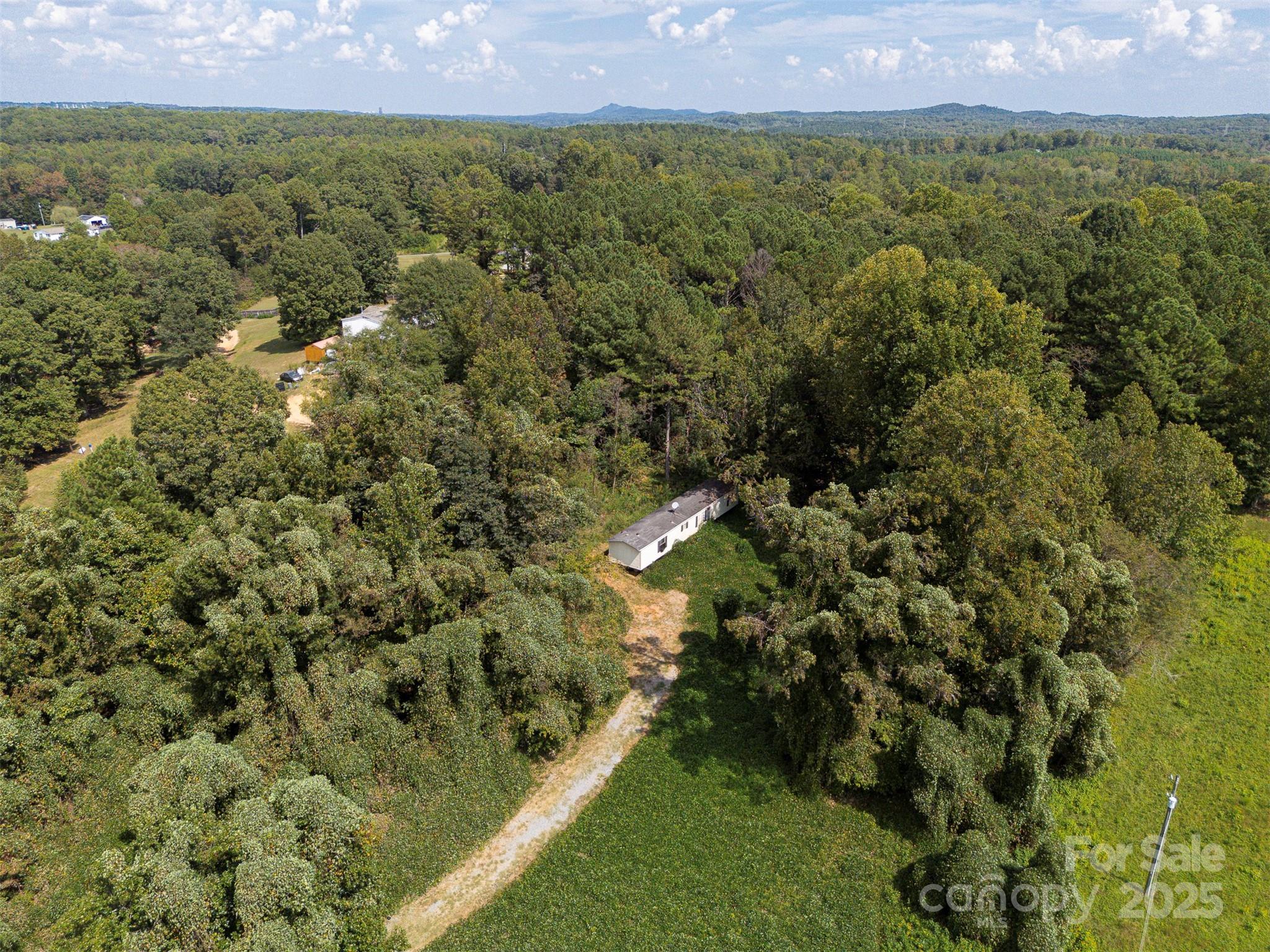 259 Roberts Road Blacksburg, SC 29702 - Photo 5 of 8 a view of a city with lush green forest