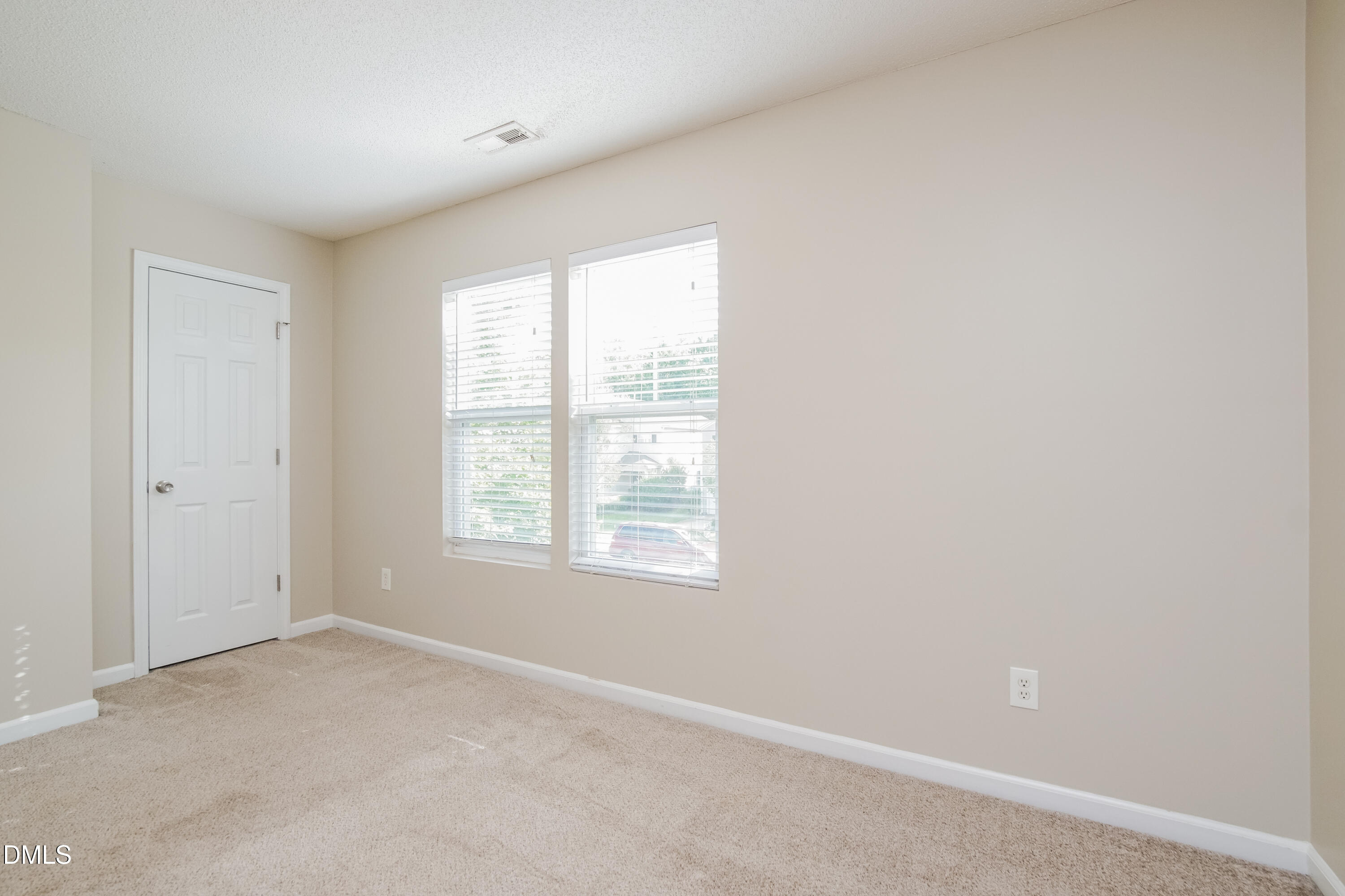 71 Brookhaven Drive Clayton, NC 27527 - Photo 11 of 17 a view of an empty room with a window