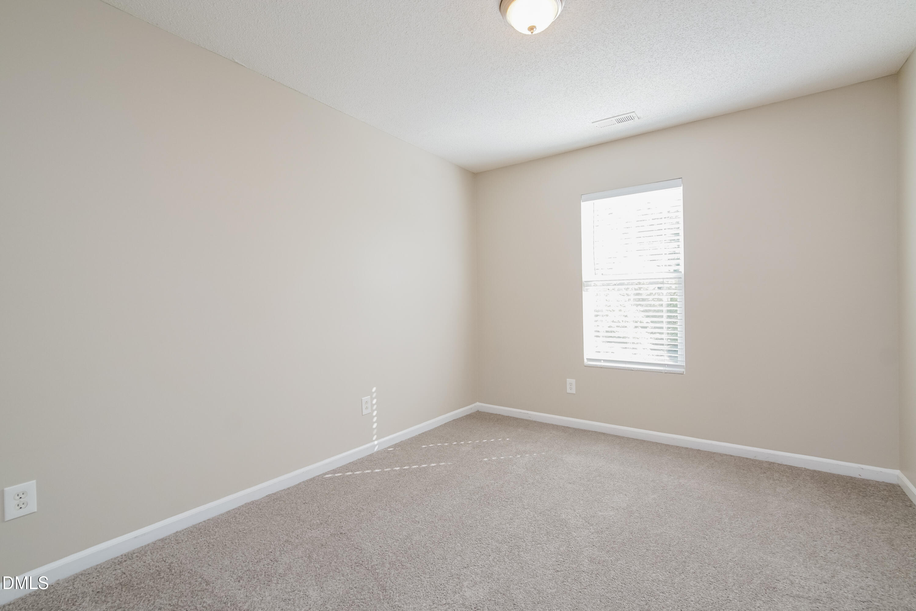 71 Brookhaven Drive Clayton, NC 27527 - Photo 12 of 17 an empty room with a window