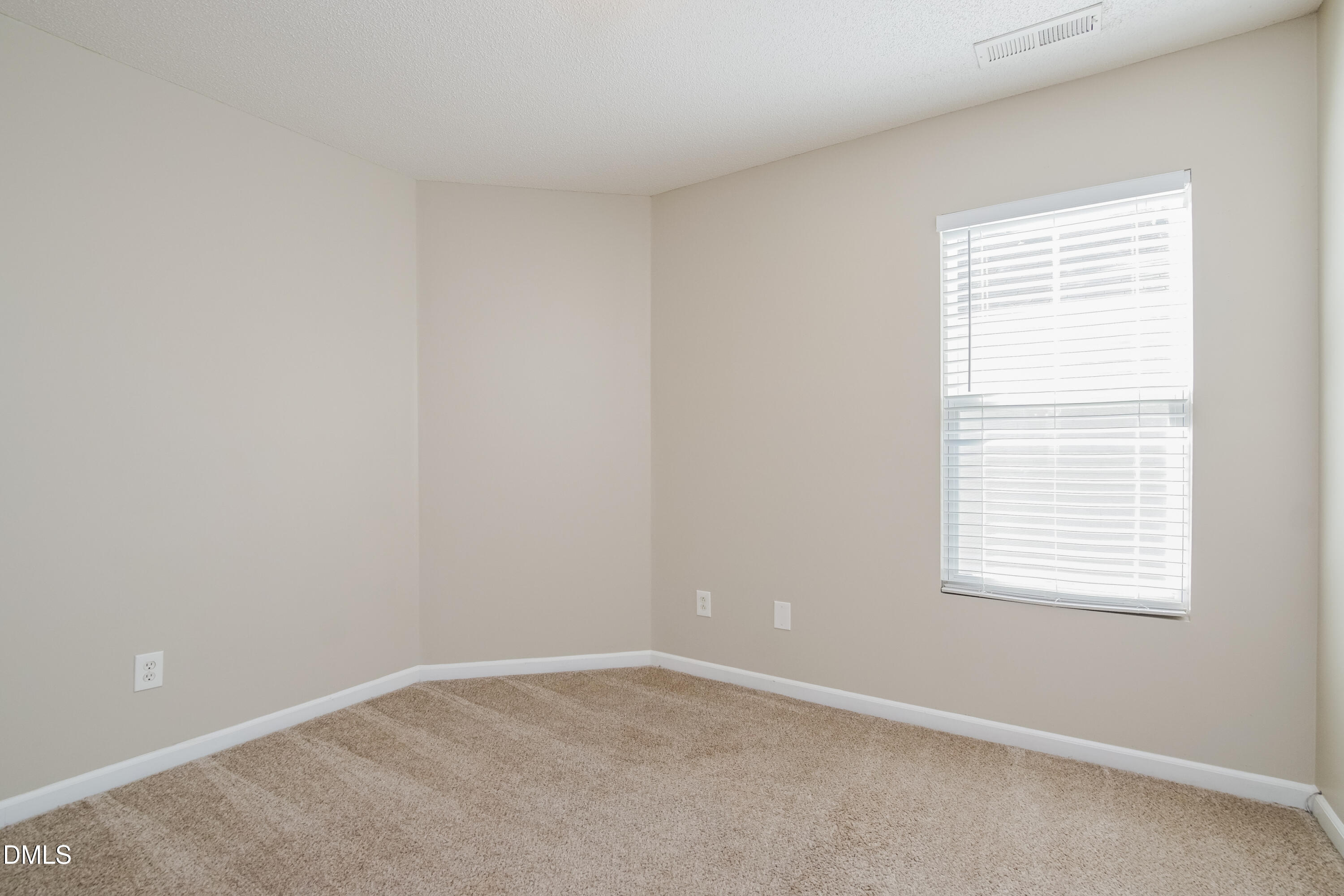 71 Brookhaven Drive Clayton, NC 27527 - Photo 10 of 17 an empty room with a window
