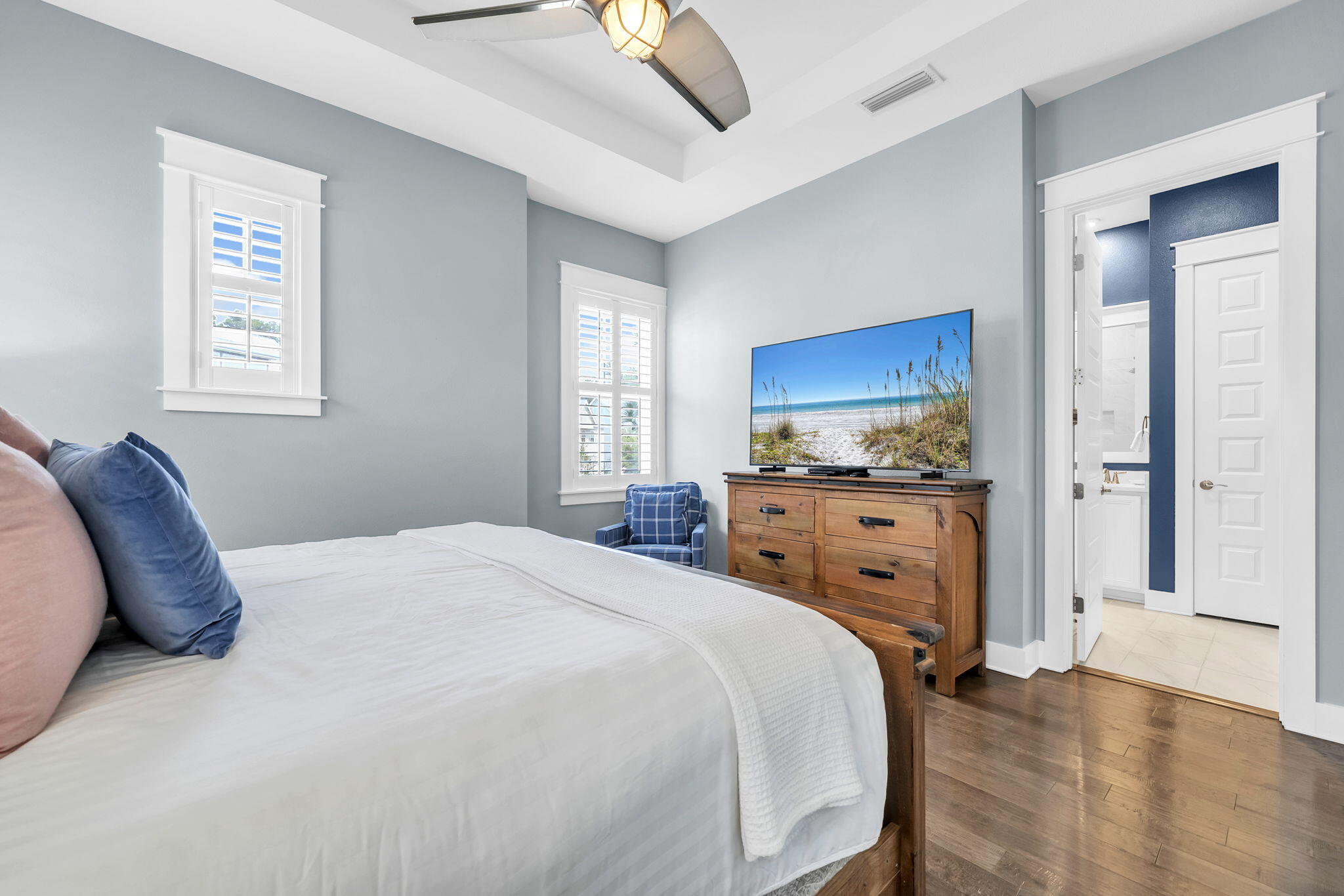 96 Dune Comet Lane, Unit A Inlet Beach, FL 32461 - Photo 22 of 47 a spacious bedroom with a bed and a view of kitchen
