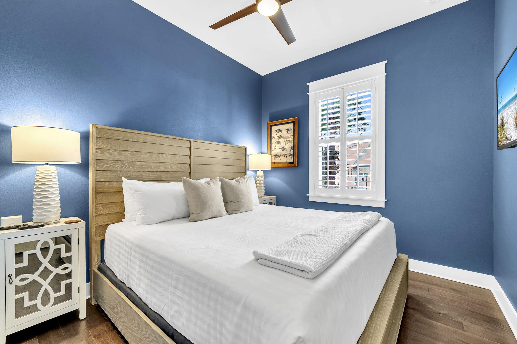 96 Dune Comet Lane, Unit A Inlet Beach, FL 32461 - Photo 26 of 47 a bedroom with a bed a mirror and a window