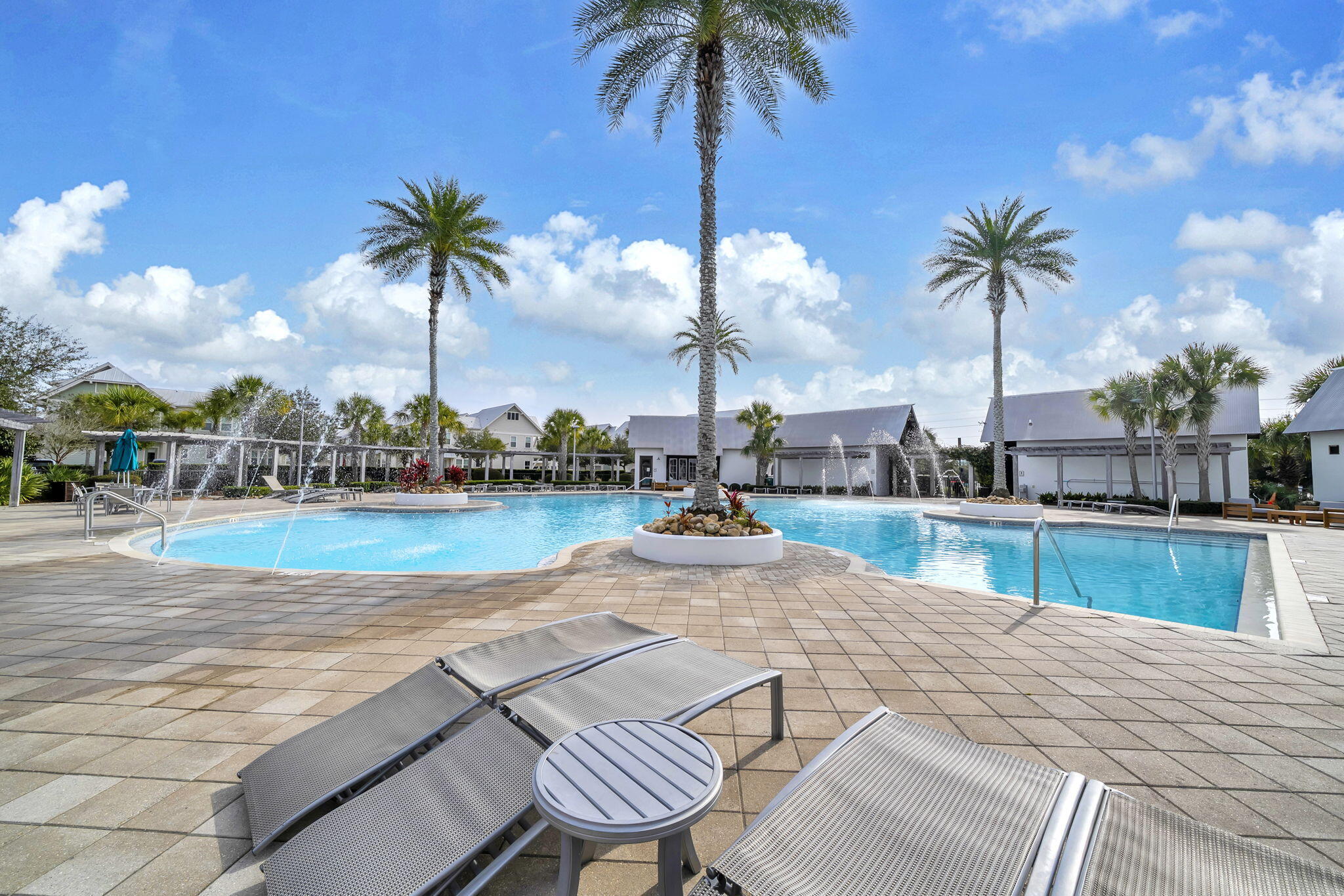 96 Dune Comet Lane, Unit A Inlet Beach, FL 32461 - Photo 39 of 47 a view of a swimming pool with a chair and palm trees
