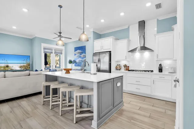 a kitchen with stainless steel appliances granite countertop a stove and a microwave