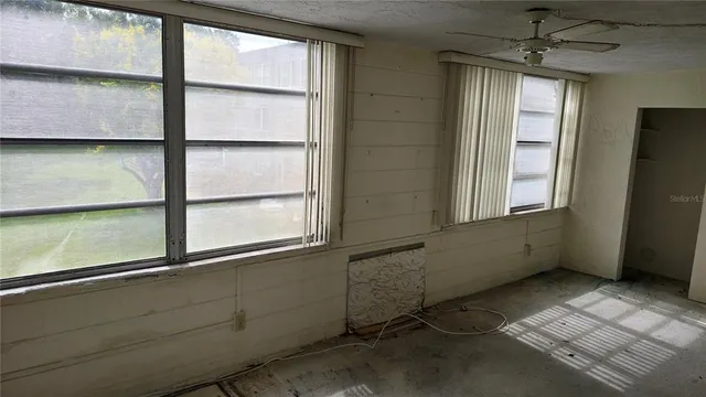 a view of empty room with windows