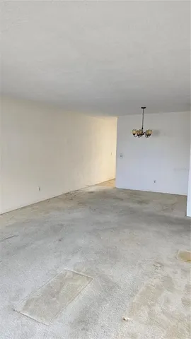 an empty room with a ceiling fan