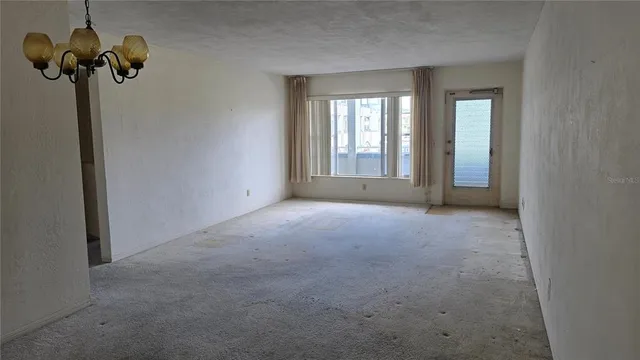a view of empty room with windows