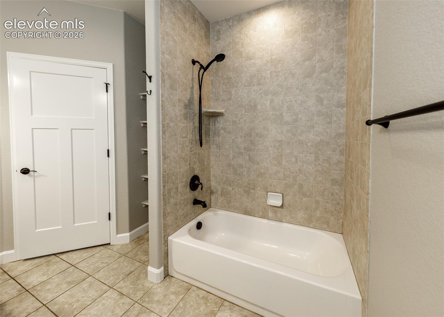 2105 Slocum Road Peyton, CO 80831 - Photo 18 of 26 Pretty custom tile in the primary bath. tub/shower.