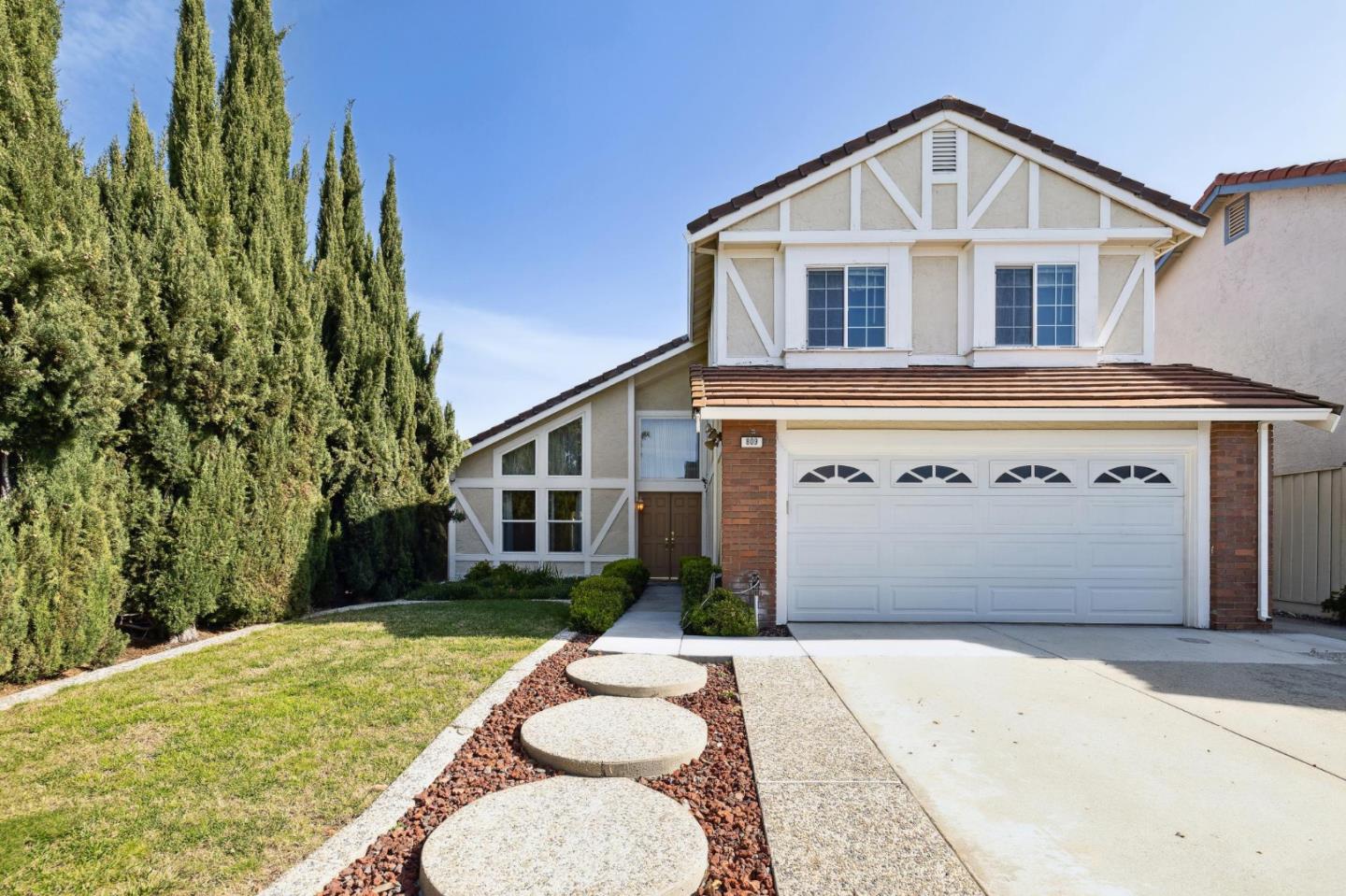 809 Terra Bella Drive Milpitas, CA 95035 - Photo 1 of 53 a front view of a house with a yard