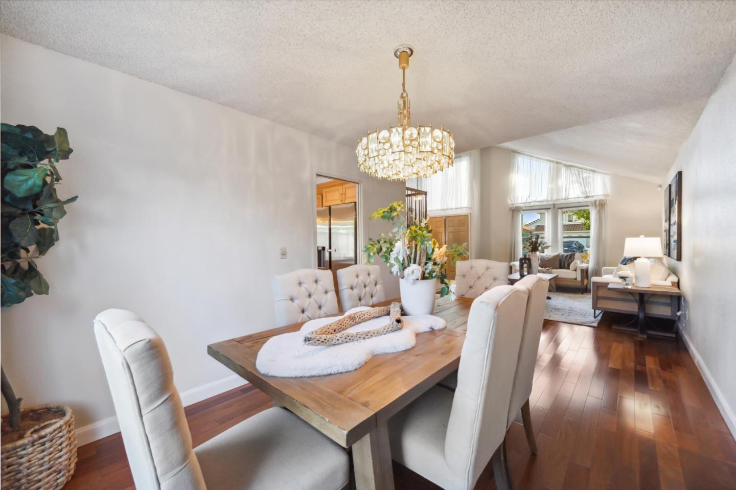 809 Terra Bella Drive Milpitas, CA 95035 - Photo 11 of 53 a view of a dining room with furniture wooden floor and chandelier