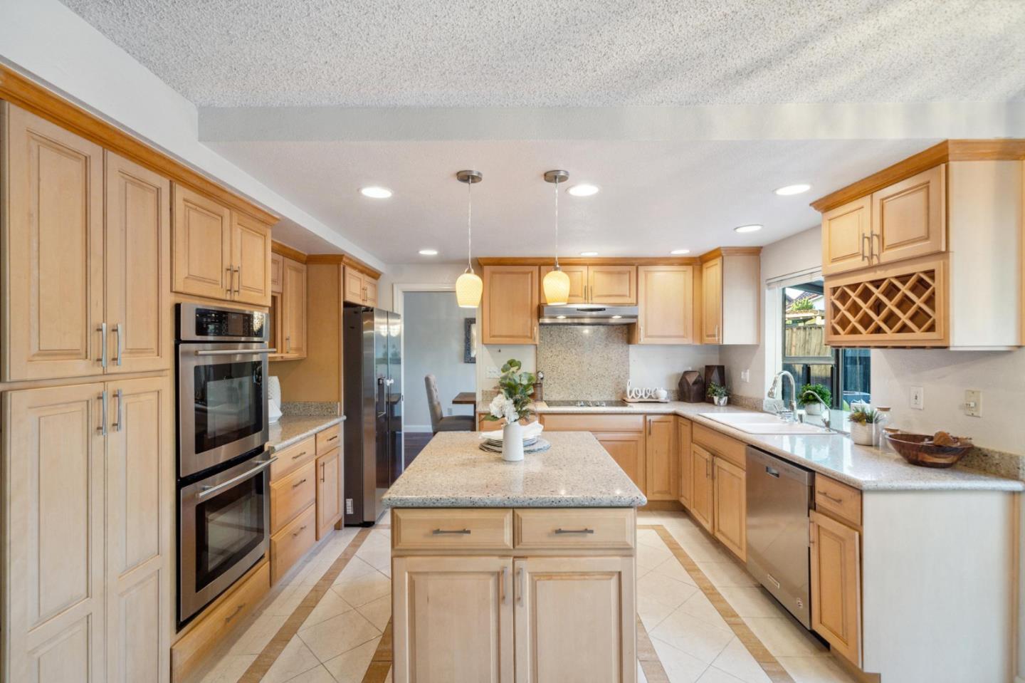 809 Terra Bella Drive Milpitas, CA 95035 - Photo 13 of 53 a kitchen with a sink refrigerator and microwave