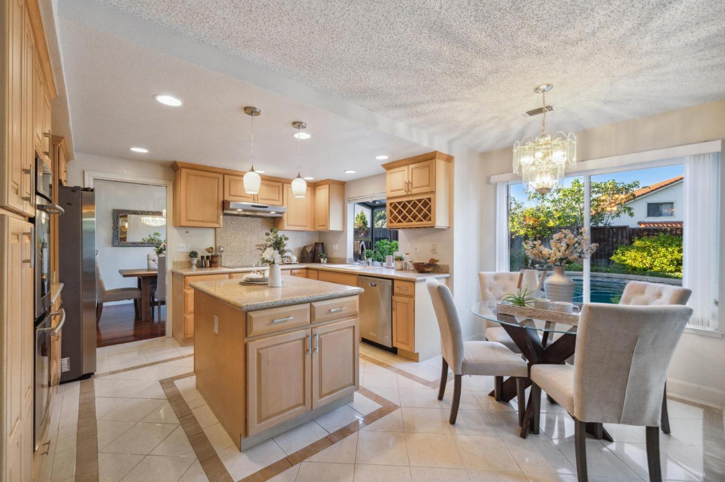 809 Terra Bella Drive Milpitas, CA 95035 - Photo 14 of 53 a kitchen that has a lot of cabinets in it and appliances