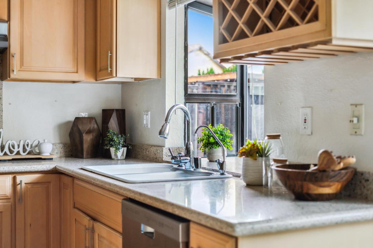 809 Terra Bella Drive Milpitas, CA 95035 - Photo 16 of 53 a kitchen with a sink and a potted plant