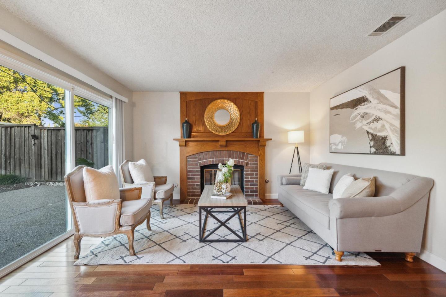 809 Terra Bella Drive Milpitas, CA 95035 - Photo 18 of 53 a living room with furniture and a fireplace