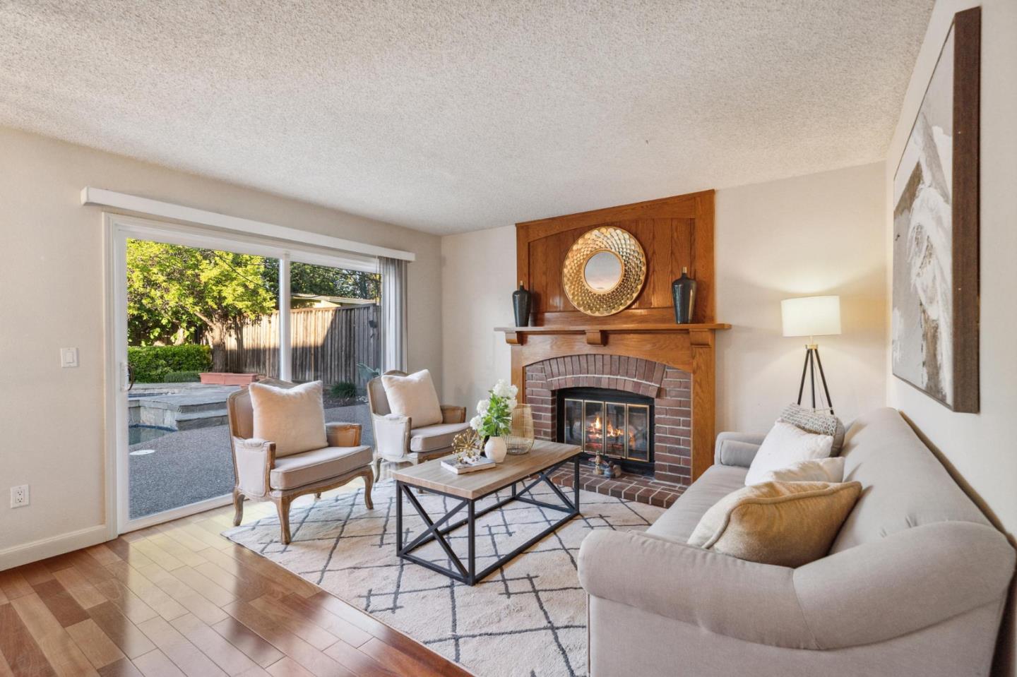 809 Terra Bella Drive Milpitas, CA 95035 - Photo 19 of 53 a living room with furniture and a fireplace