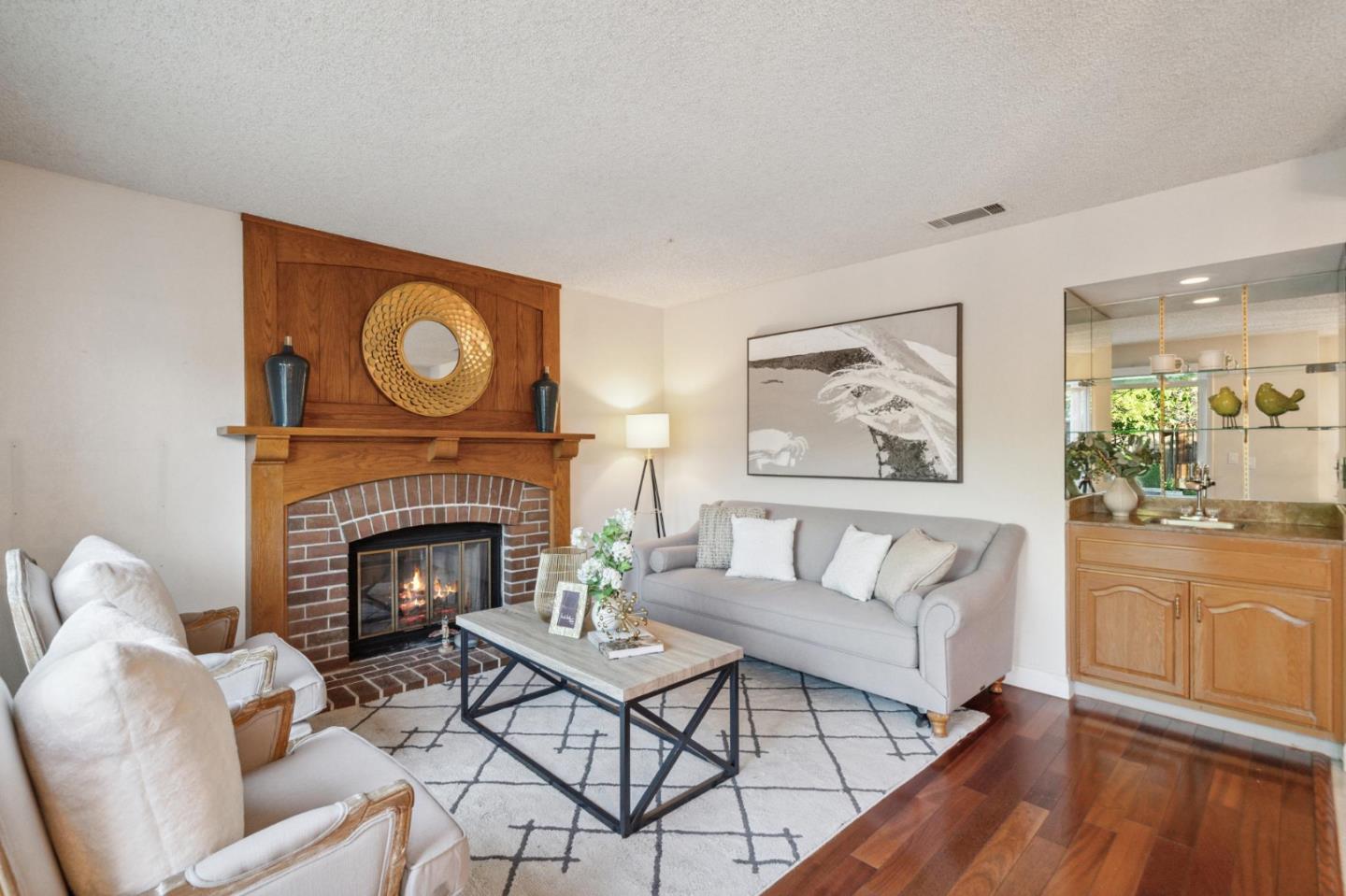 809 Terra Bella Drive Milpitas, CA 95035 - Photo 20 of 53 a living room with furniture and a fireplace