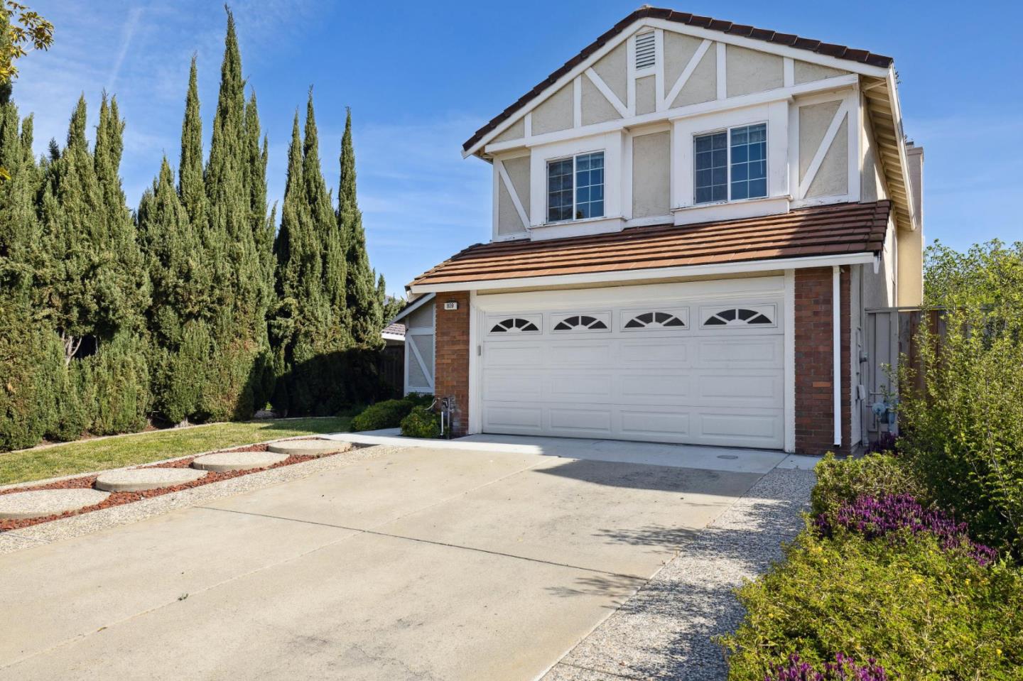 809 Terra Bella Drive Milpitas, CA 95035 - Photo 2 of 53 a front view of a house with a yard and garage