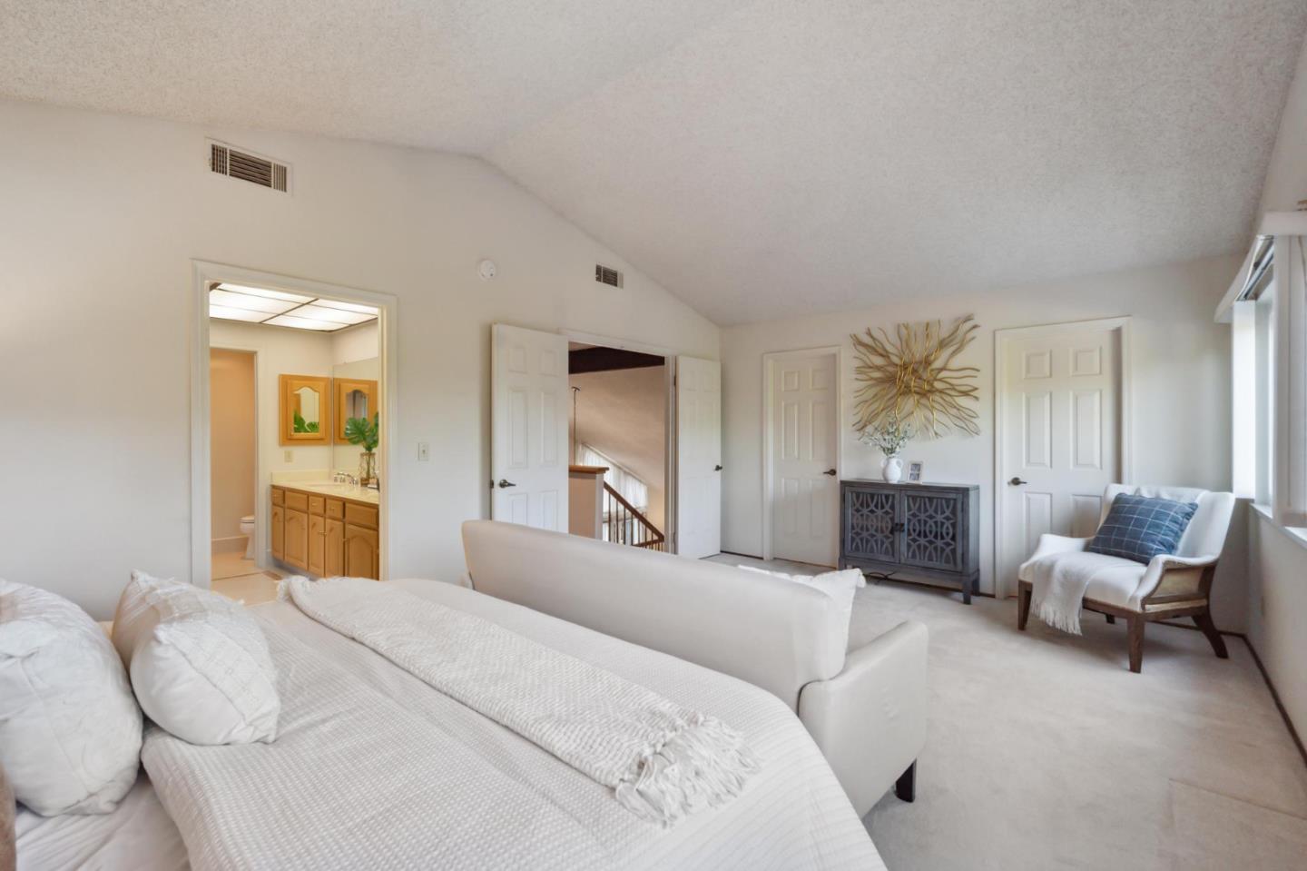 809 Terra Bella Drive Milpitas, CA 95035 - Photo 25 of 53 a bedroom with a large bed couch and two windows