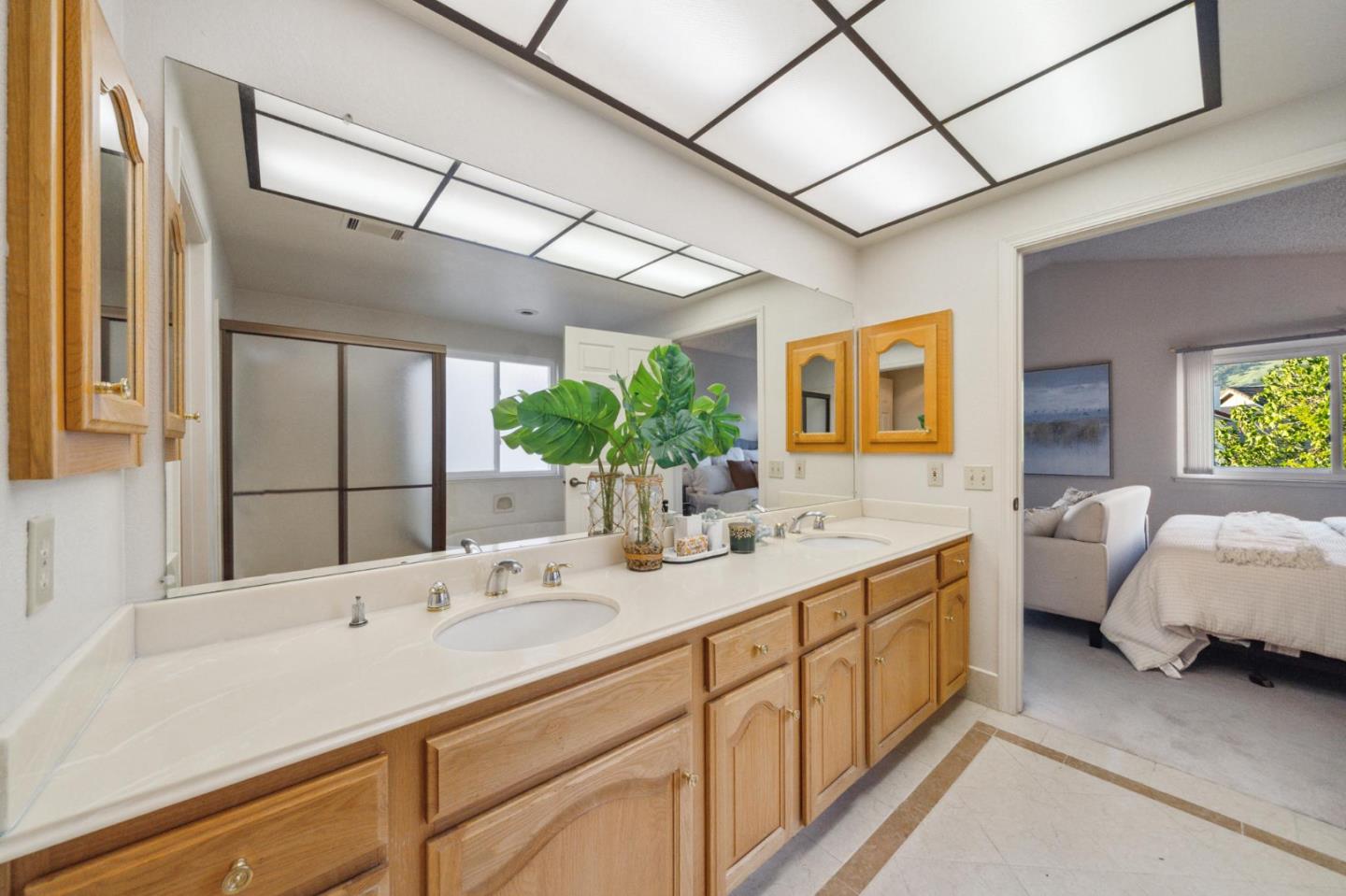 809 Terra Bella Drive Milpitas, CA 95035 - Photo 30 of 53 a bathroom with a double vanity sink and mirror
