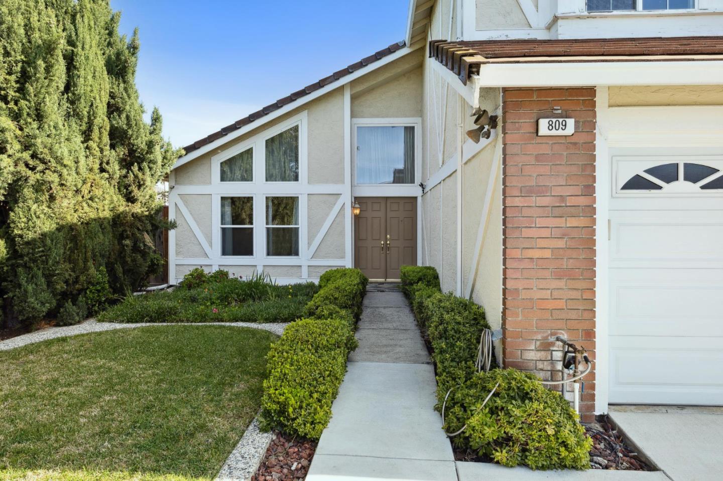 809 Terra Bella Drive Milpitas, CA 95035 - Photo 3 of 53 a front view of a house with a yard
