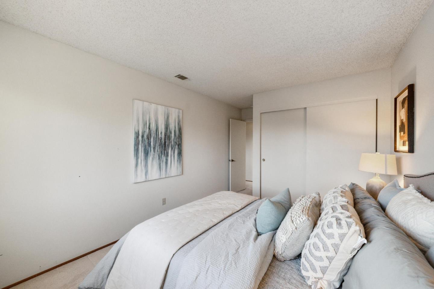 809 Terra Bella Drive Milpitas, CA 95035 - Photo 40 of 53 a bedroom with a bed and a painting on the wall