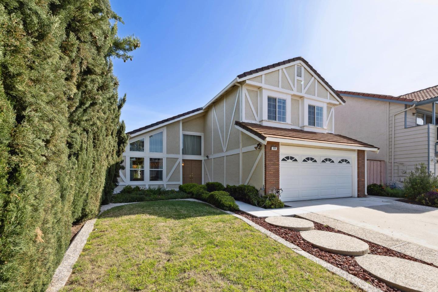 809 Terra Bella Drive Milpitas, CA 95035 - Photo 4 of 53 a front view of a house with a yard