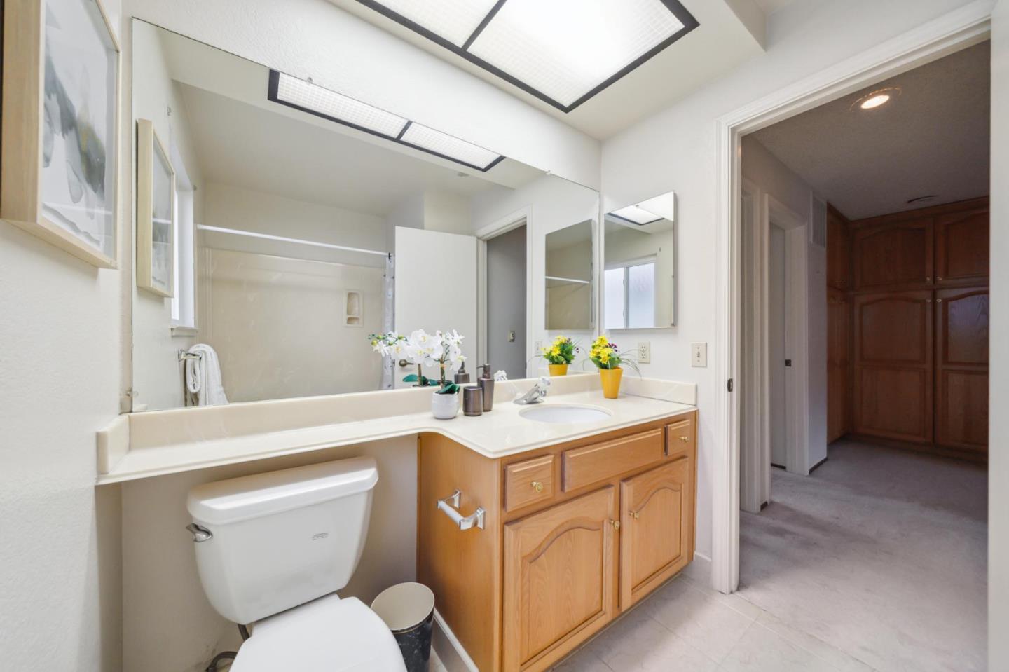 809 Terra Bella Drive Milpitas, CA 95035 - Photo 44 of 53 a view of bathroom with a sink toilet and a mirror