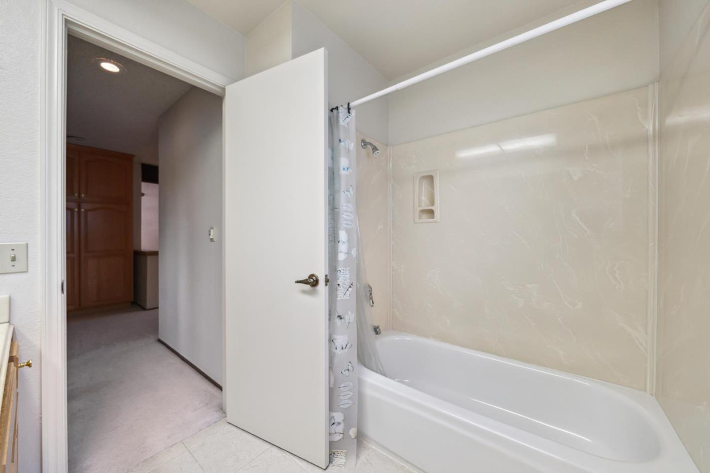 809 Terra Bella Drive Milpitas, CA 95035 - Photo 45 of 53 a bathroom with a bathtub and shower