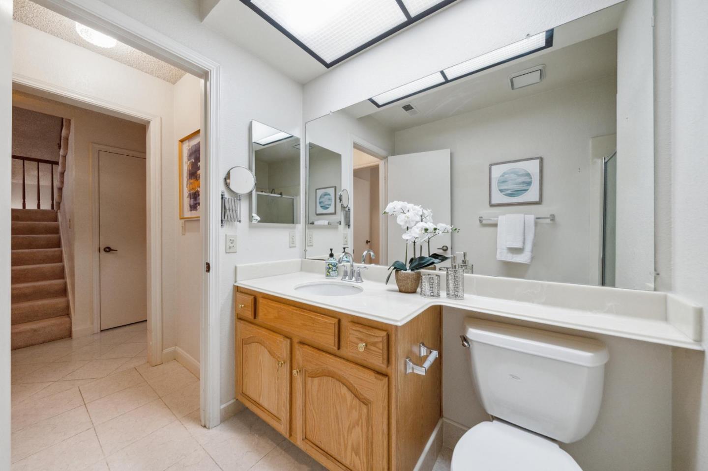 809 Terra Bella Drive Milpitas, CA 95035 - Photo 47 of 53 a spacious bathroom with a toilet sink and mirror