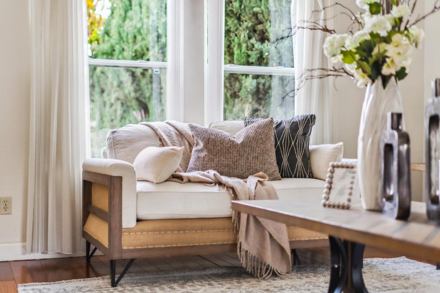 809 Terra Bella Drive Milpitas, CA 95035 - Photo 9 of 53 a living room with furniture a potted plant and a large window