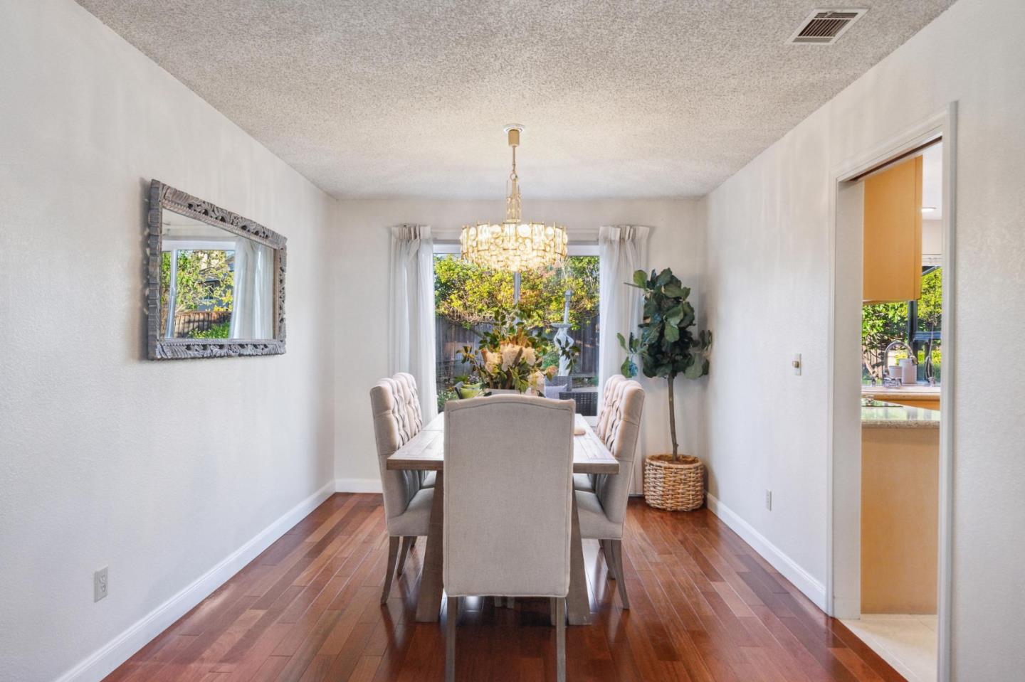 809 Terra Bella Drive Milpitas, CA 95035 - Photo 10 of 53 a view of a dining room with furniture window and wooden floor