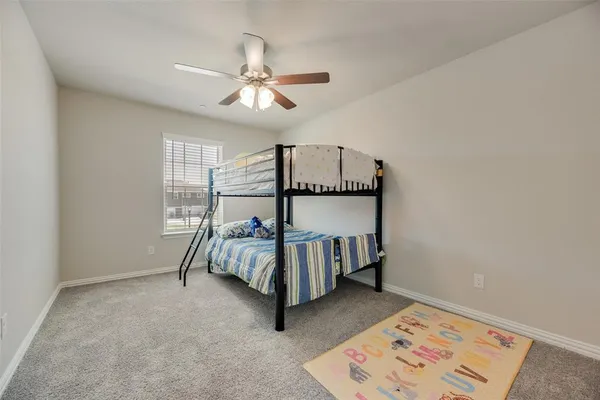 a bedroom with furniture and window