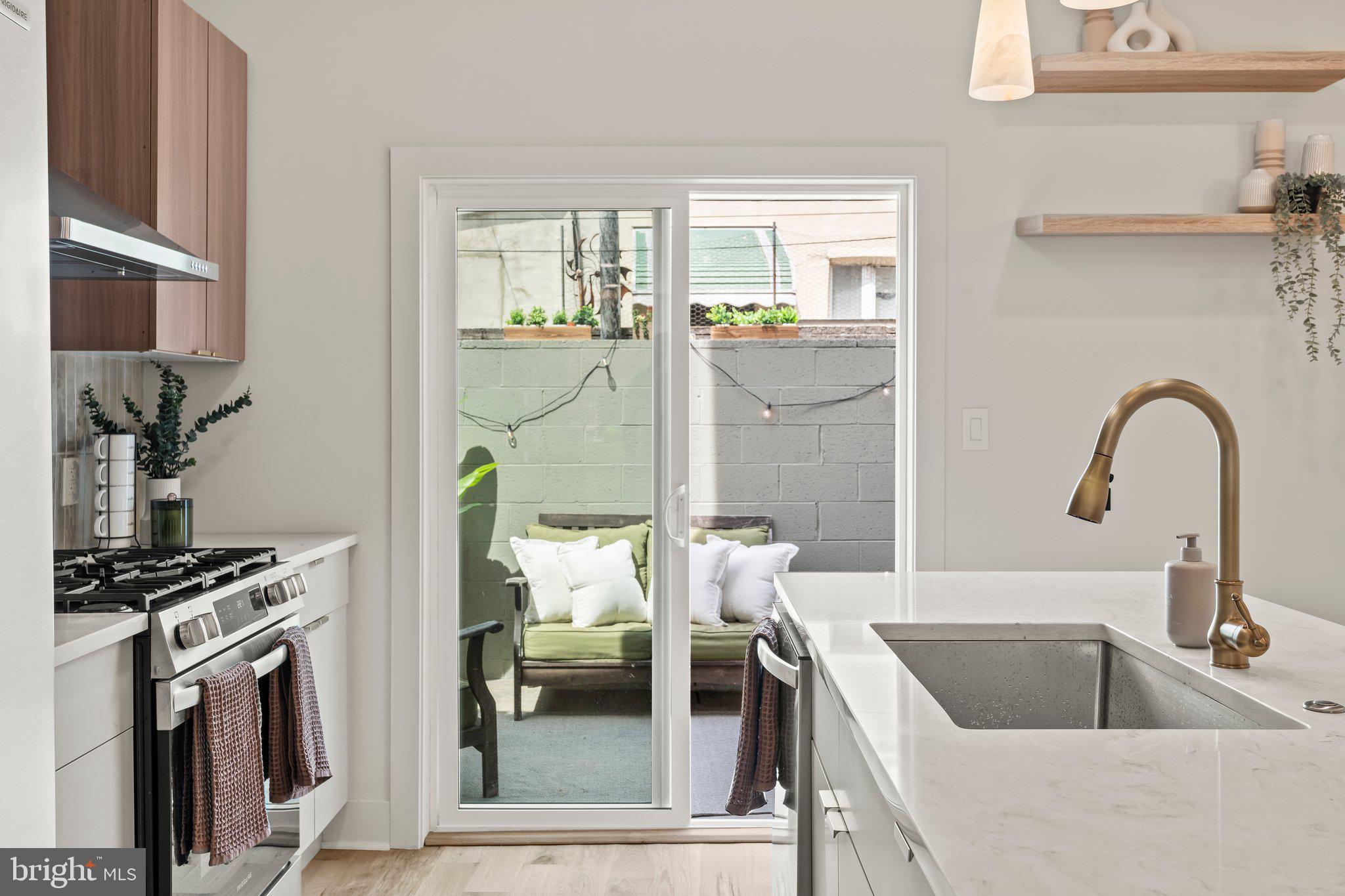 1031 Mercy Street Philadelphia, PA 19148 - Photo 17 of 34 a kitchen with a refrigerator and a sink