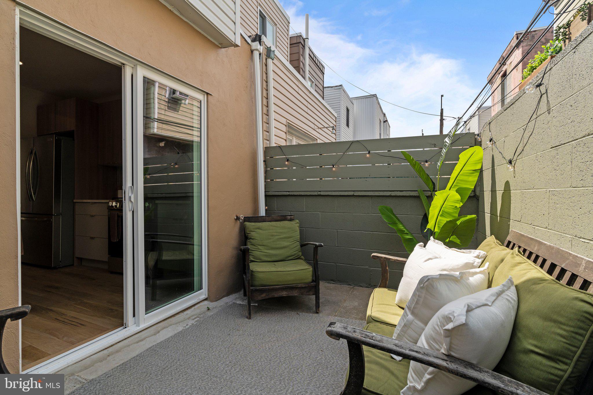 1031 Mercy Street Philadelphia, PA 19148 - Photo 19 of 34 a view of a patio with a table and chairs