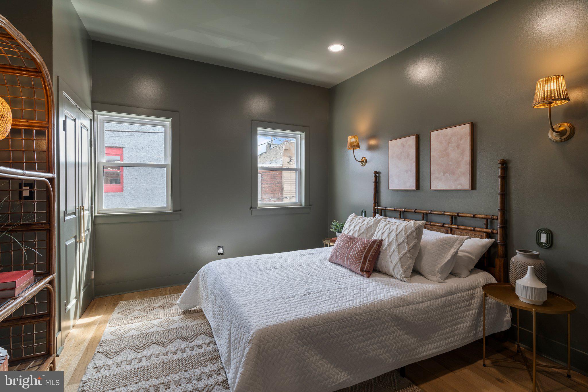 1031 Mercy Street Philadelphia, PA 19148 - Photo 21 of 34 a bedroom with a bed and a lamp