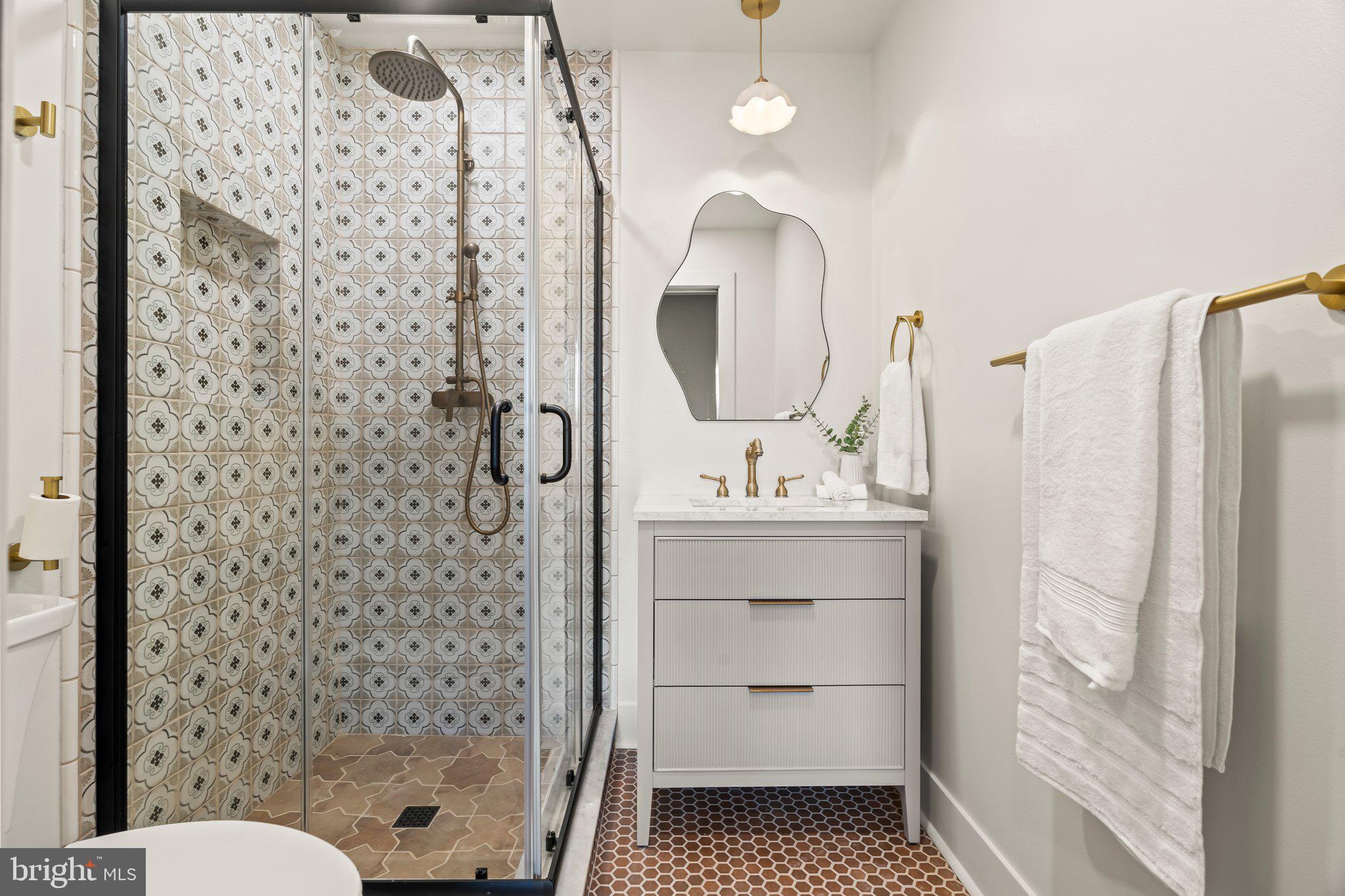 1031 Mercy Street Philadelphia, PA 19148 - Photo 25 of 34 a bathroom with a sink a toilet and shower