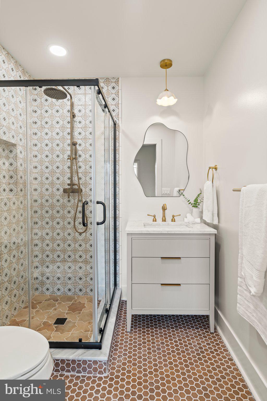 1031 Mercy Street Philadelphia, PA 19148 - Photo 27 of 34 a bathroom with a sink a toilet and shower