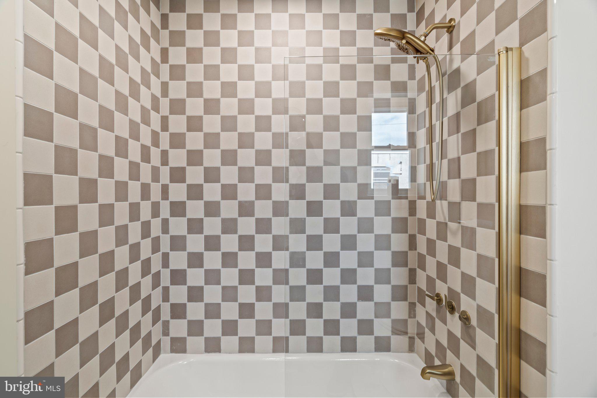 1031 Mercy Street Philadelphia, PA 19148 - Photo 30 of 34 a bathroom with a bathtub and shower